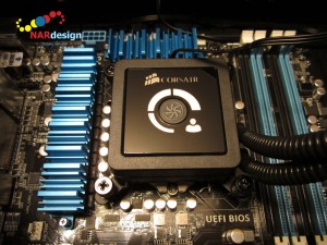 Corsair H100 Extreme Performance Liquid CPU cooling block mounted on the motherboard